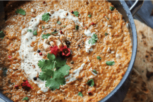 Thermomix dahl in big pot with naan