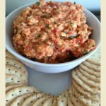 thermomix roast capsicum dip in white bowl with crackers around