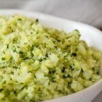 close up thermomix cauliflower rice in white dish, napkin behind