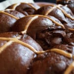 close up double chocolate hot cross buns on tray