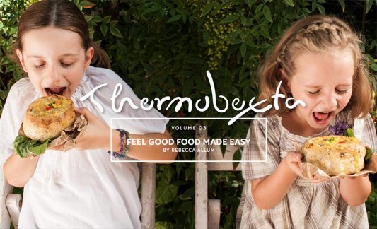 feel good food made easy cover page, two girls excited to eat their bread bowls filled with soup!